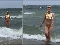 На пляже сняли обнажённую купальщицу в золоте (видео)