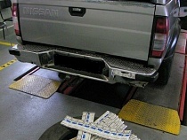 Контрабандист из Калининграда спрятал сотни пачек сигарет в запаске